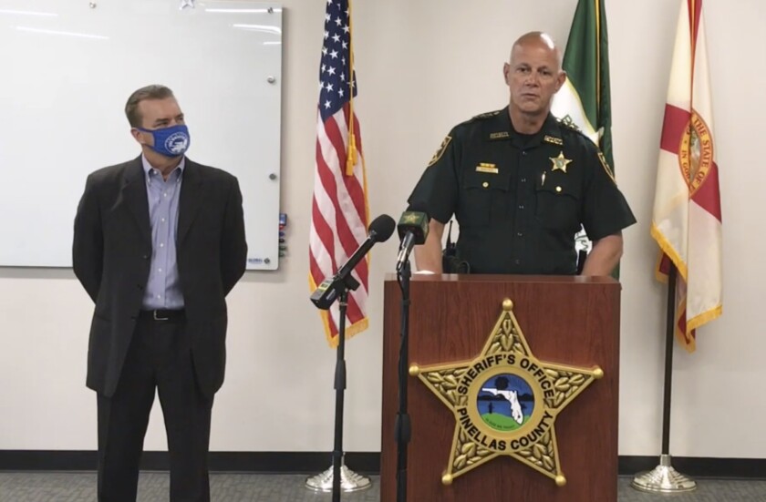 In this screen shot from a YouTube video posted by the Pinellas County Sheriff's Office, Pinellas County Sheriff Bob Gualtieri speaks during a news conference as Oldsmar, Fla., Mayor Eric Seidel, left, listens, Monday, Feb. 8, 2021, in Oldsmar, Fla. Authorities say a hacker gained access to Oldsmar's water treatment plant in an unsuccessful attempt to taint the water supply with a caustic chemical. (Pinellas County Sheriff's Office via AP)