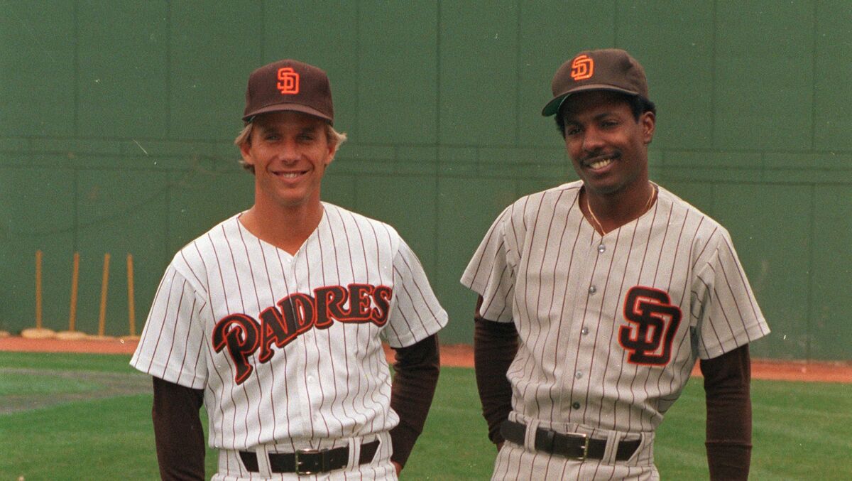 Tim Flannery, left, shows off the Padres 1985 home uniform and second baseman Alan Wiggins models travel gray.