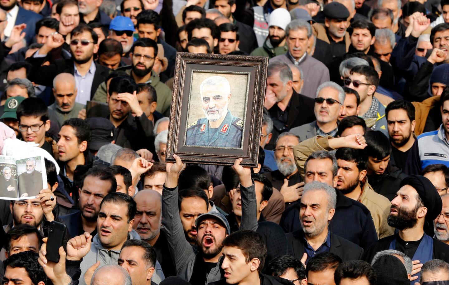 Thousands march in Tehran after the death of Gen. Qassem Suleimani, head of the elite Quds Force, in a U.S. airstrike.