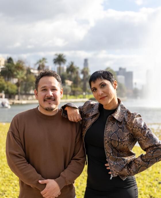 Sergio Lira and Lynette Coll pose for photos at Echo Park Lake on Friday, Feb. 9, 2024.