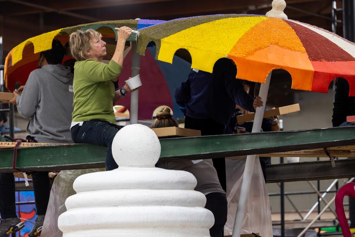 Dee Garner works on Fort Lauderdale float for Rose parade "Visit Lauderdale - Everyone Under The Sun"