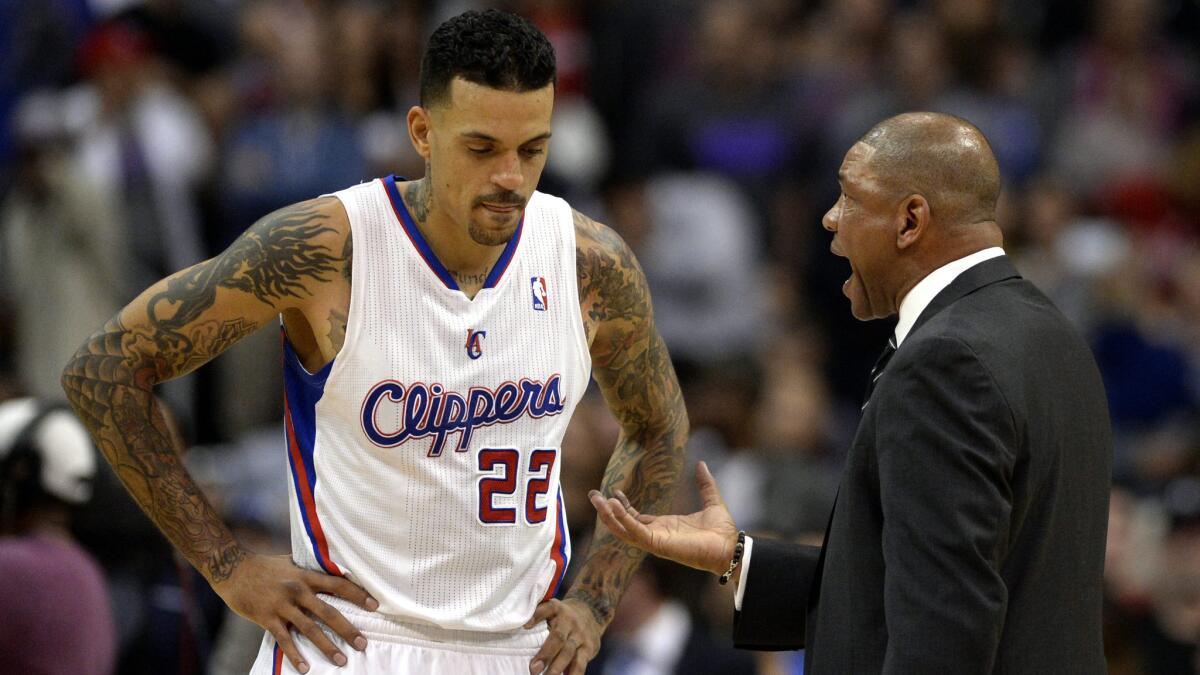 Clippers Coach Doc Rivers speaks with Matt Barnes during a game in January.