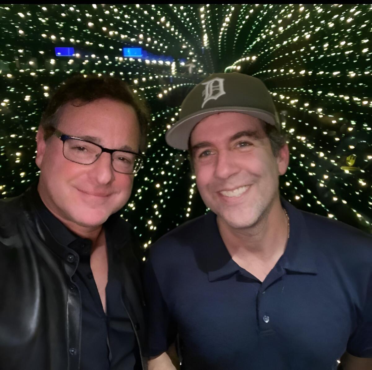 Two male comedians posing for a selfie