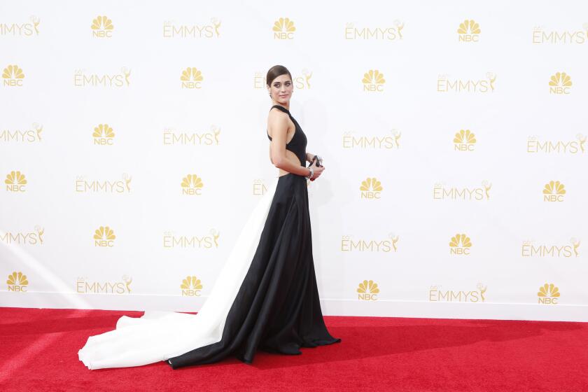 The train on Lizzy Caplan's lovely Emmys gown was a tripping hazard.