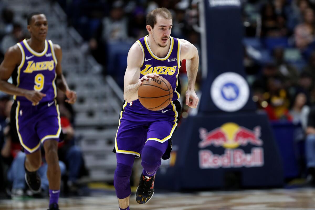Lakers guard Alex Caruso brings the ball up court during a game against the Pelicans last season in New Orleans.