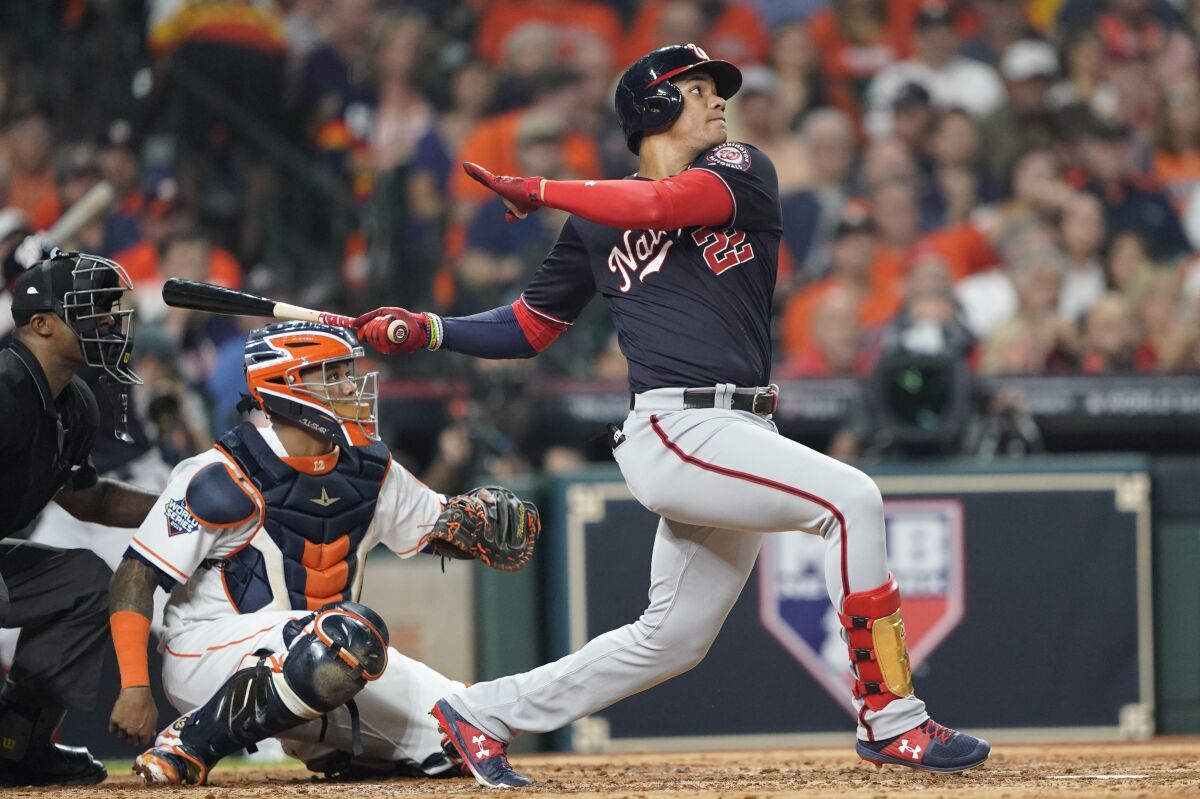 Washington Nationals' Juan Soto hits a solo home run off Houston Astros' Gerrit Cole during Game 1 of the World Series on Oct. 22.