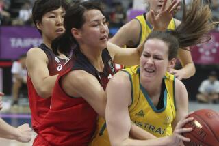 Australia''s Keely Jane Froling (11), right, and Japan''s Mamiko Tanaka (12) fight for a loose ball