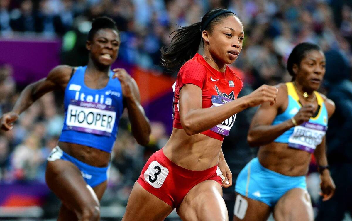 Southern California's Allyson Felix, center, pulls ahead to win her heat in the 200 meters at the 2012 London Olympics. She went on to capture the gold medal, which will reap her a $25,000 honorarium from the U.S. Olympic Committee.