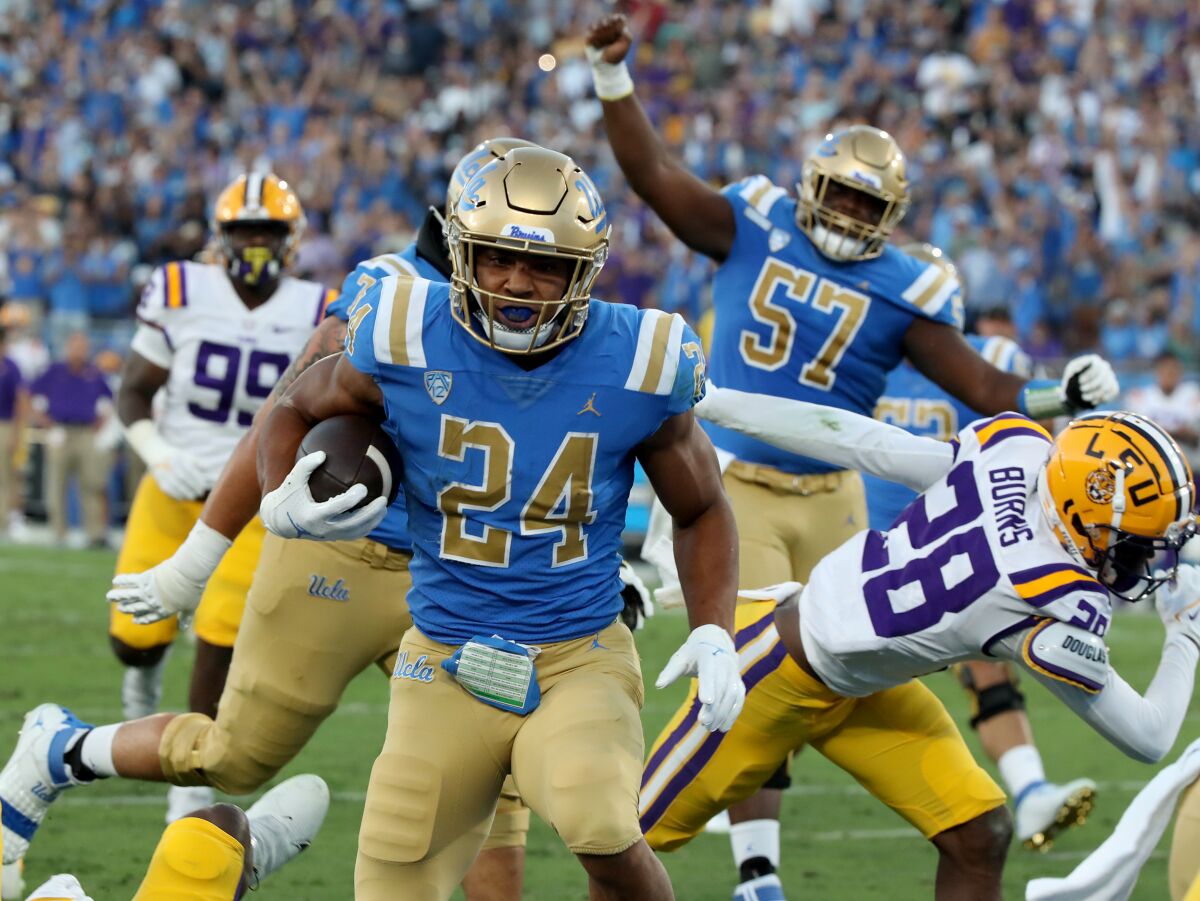 UCLA running back Zach Charbonnet scores against LSU at the Rose Bowl on Sept. 4, 2021. 