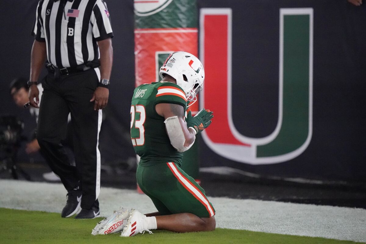 Miami running back Cam'Ron Harris celebrates after a touchdown during the second half of an NCAA college football game against Appalachian State, Saturday, Sept. 11, 2021, in Miami Gardens, Fla. (AP Photo/Wilfredo Lee)