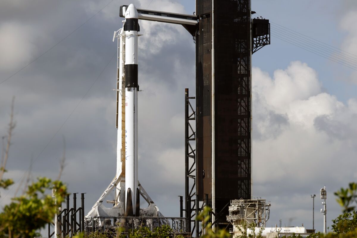 A SpaceX Falcon 9 rocket, with the Crew Dragon spacecraft, stands ready for launch to the International Space Station on pad 39A at the Kennedy Space Center in Cape Canaveral, Fla., Sunday, May 21, 2023. (AP Photo/Terry Renna)