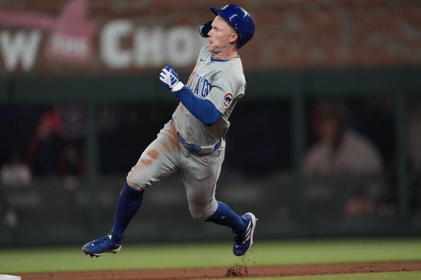 Chicago Cubs' Pete Crow-Armstrong rounds the bases after hitting a triple in the eighth inning of a baseball game against the Atlanta Braves Wednesday, May 15, 2024, in Atlanta. (AP Photo/John Bazemore)