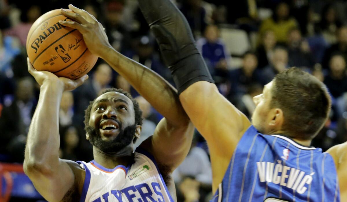 Luc Mbah a Moute, left, vies for the ball against Nikola Vucevic during a basketball match in South Africa on Aug. 1.