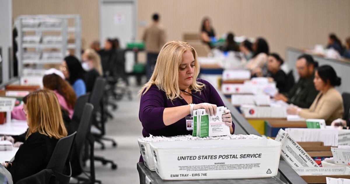 Photo: Los Angeles Times FILE - A worker sorts ballots at the L.A. County Ballot Processing Center during the California primary election, June 2