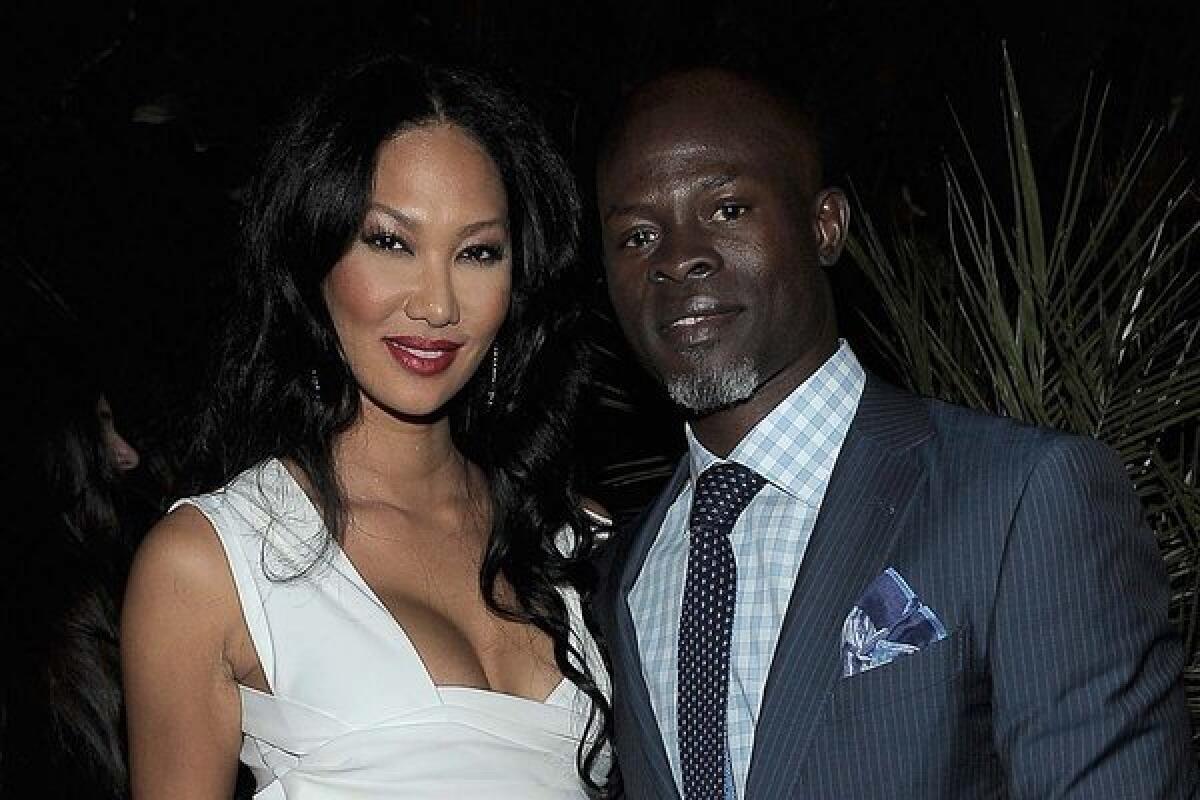Kimora Lee Simmons and Djimon Hounsou at an event in February.