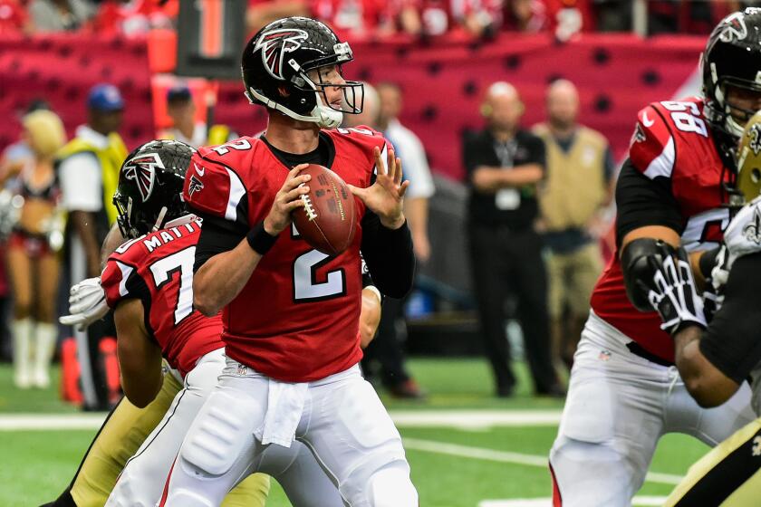 Falcons quarterback Matt Ryan sets himself in the pocket for a pass against the Saints in the first half Sunday in Atlanta.
