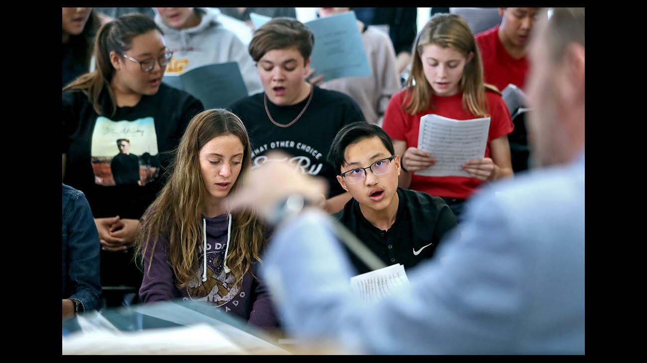 Sophomores Ellaney Materese, left, and Adam Driscoll, right, sing along to the direction of Dr. Jeff Brookey in the Concert Choir class, at La Canada High School in La Canada Flintridge on Tuesday, Sept. 18, 2018. The program is the largest single program at the school, larger than football, basketball and theater combined, with about 300 students.