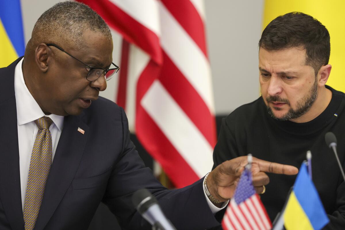 Secretary of Defense Lloyd J. Austin III and Ukrainian President Volodymyr Zelensky talk.