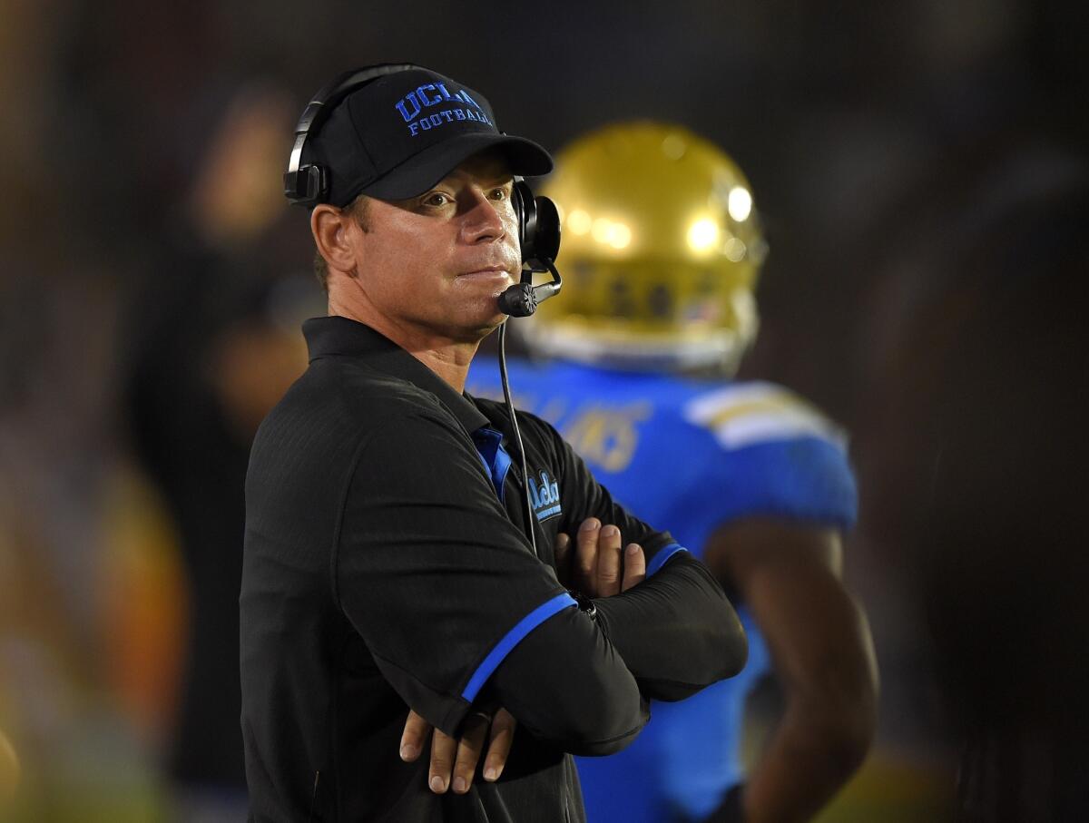 UCLA Coach Jim Mora looks on during the second half of the Bruins' 42-35 win over Memphis at the Rose Bowl on Sept. 6.