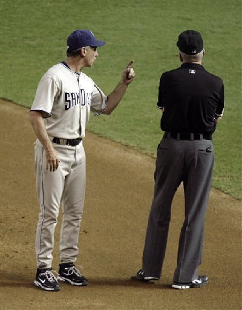 San Diego Padres manager Bud Black, left, argues with first base umpire Mike Everitt after Everitt called out Padres' Chris Denorfia on a close play at first in the sixth inning of a baseball game against the Arizona Diamondbacks on Tuesday, Aug. 31, 2010, in Phoenix. Everitt ejected Black from the game. (AP Photo/Paul Connors)