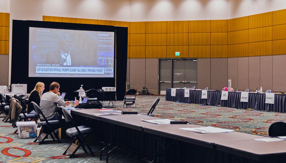 The incident command works in a large room within the San Diego Convention Center.