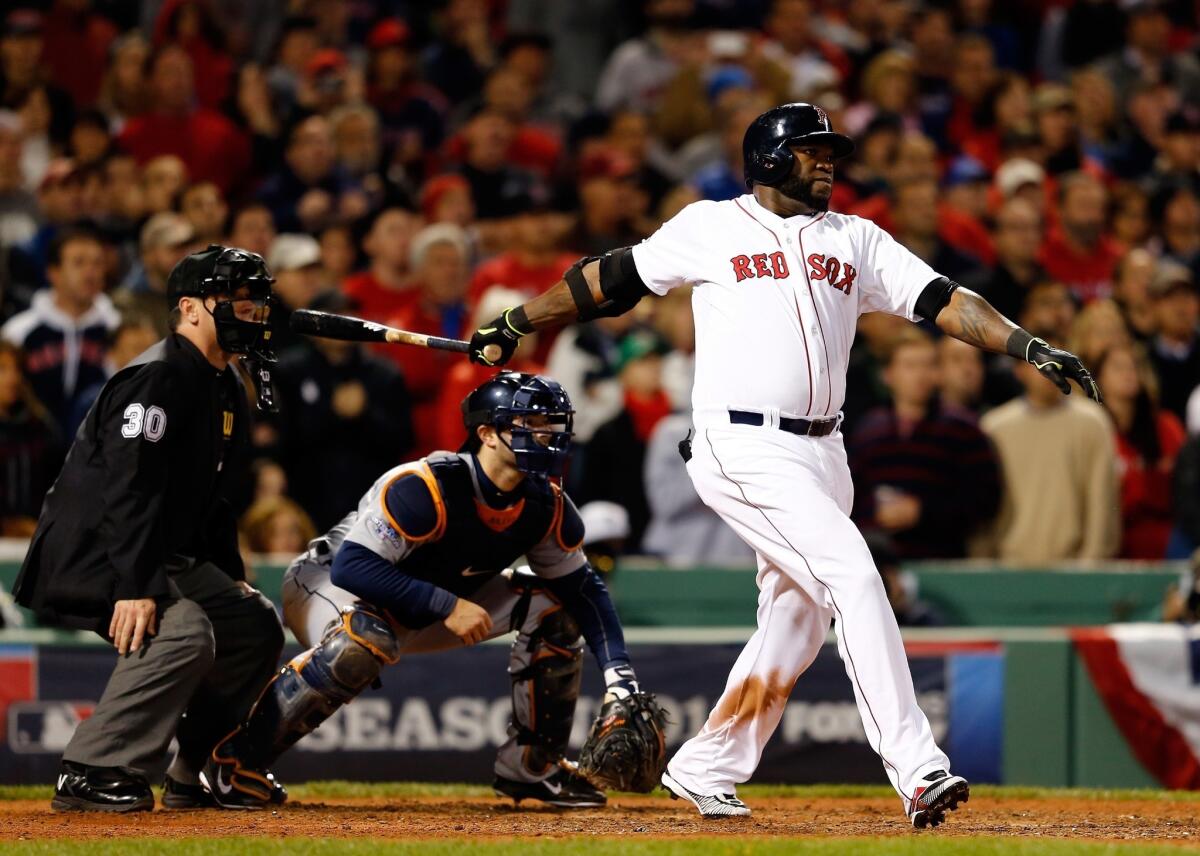 Boston's David Ortiz hits a game-tying grand slam in the eighth inning during the Red Sox's 6-5 win over the Detroit Tigers in Game 2 of the American League Championship Series on Sunday.