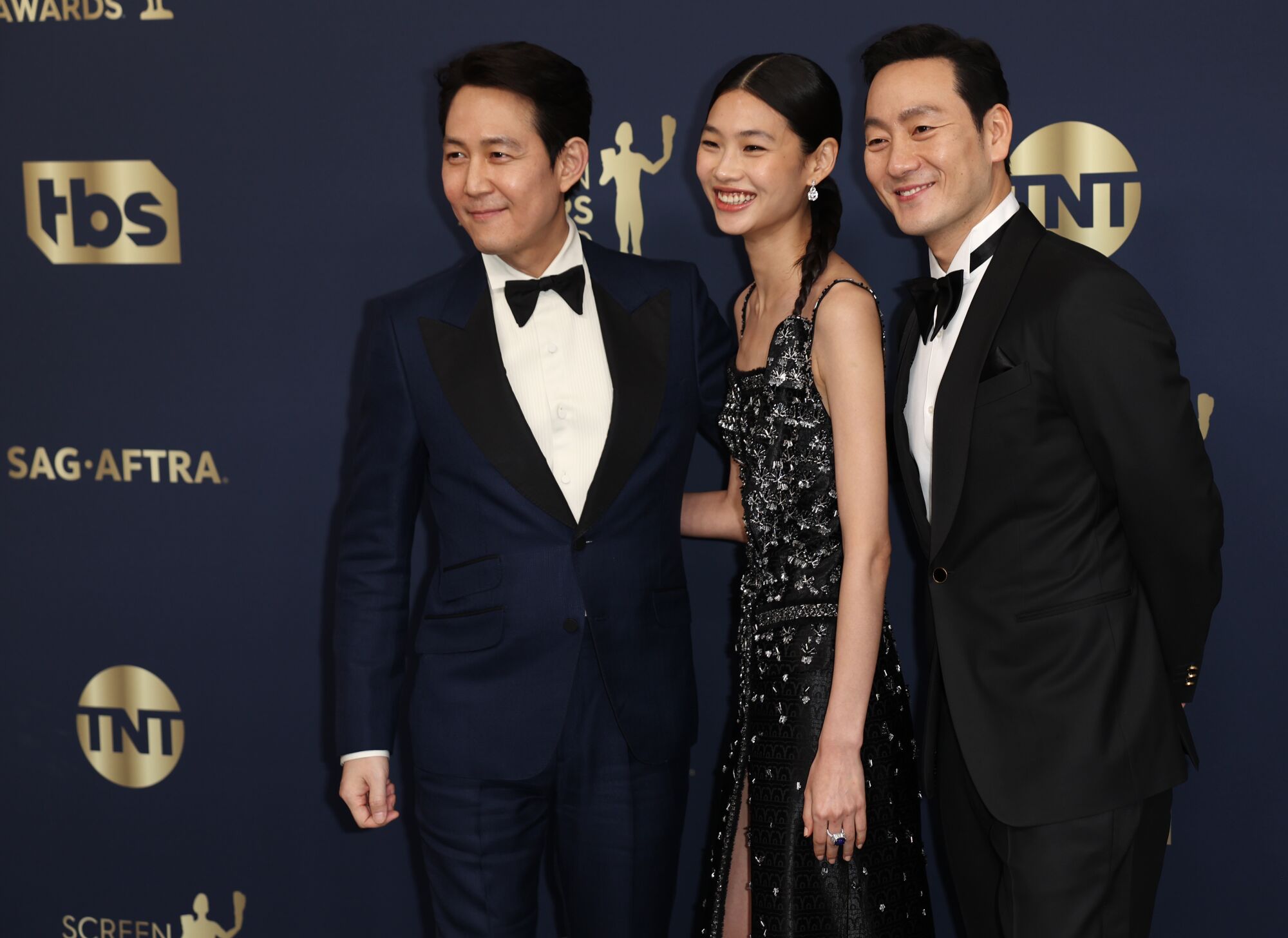 Lee Jung-jae, HoYeon Jung and Park Hae-soo arriving at the 28th Screen Actors Guild Awards. 