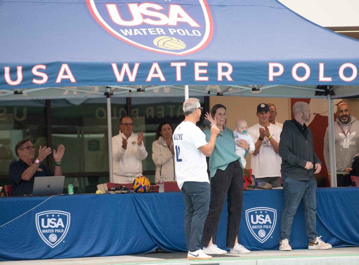 Fans, coaches and colleagues celebrate Olympic women's water gold medalist Alys Williams on Monday. 