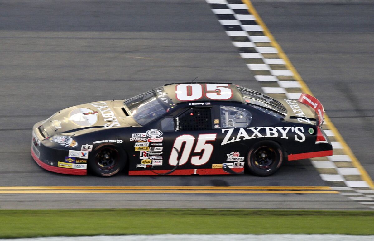 FILE - In this Feb. 13, 2016, file photo, John Wes Townley crosses the finish line to win the ARCA series auto race at Daytona International Speedway in Daytona Beach, Fla. Former NASCAR driver Townley was killed Saturday, Oct. 2, 2021, in a shooting in Georgia that also wounded a woman, investigators said. Townley, 31, died in the shooting in a neighborhood around 9 p.m., Athens-Clarke County Coroner Sonny Wilson told the Athens Banner-Herald. (AP Photo/Terry Renna, File)
