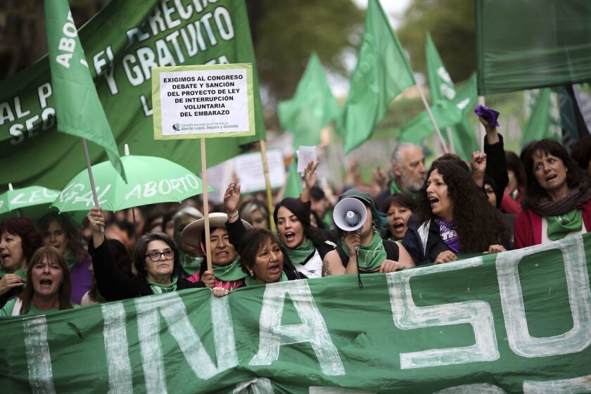 People demonstrate for legal abortion during a march in Buenos Aires. Activists called for a new law that decriminalizes abortion within a set period and extends the cases in which it is allowed.