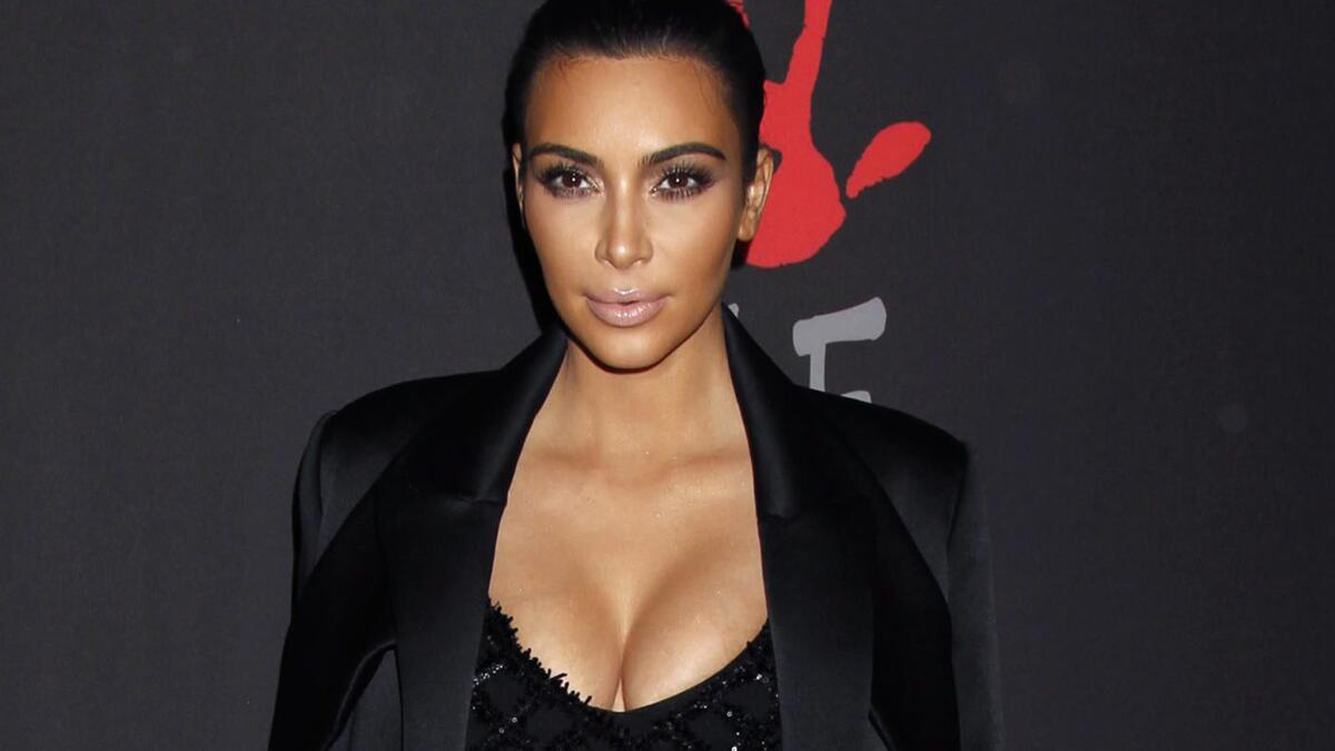 Here's a picture of Kim Kardashian's cleavage, in case the shot below, which will be her book cover, isn't enough.
