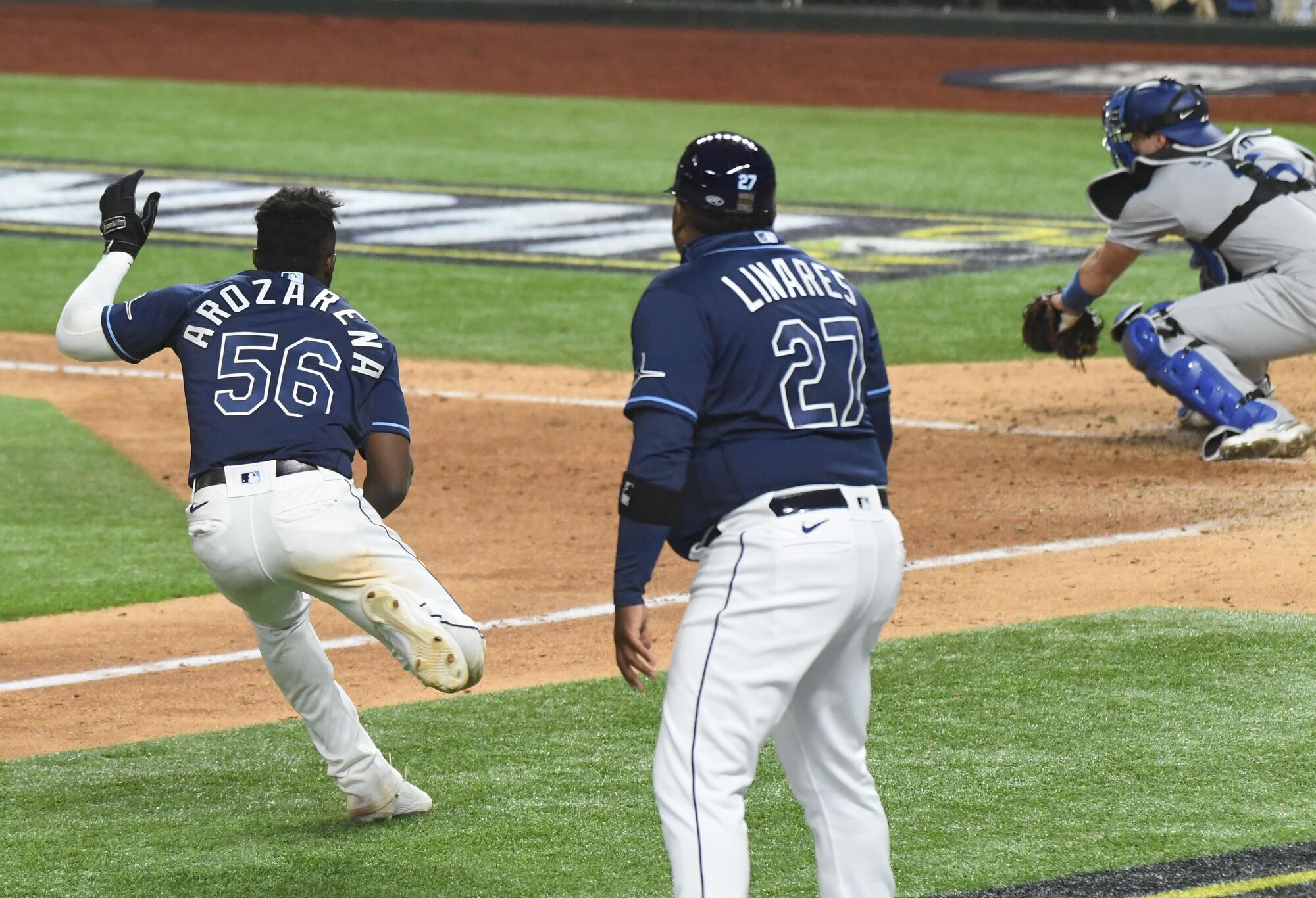 Tampa Bay baserunner Randy Arozarena stops before home plate.
