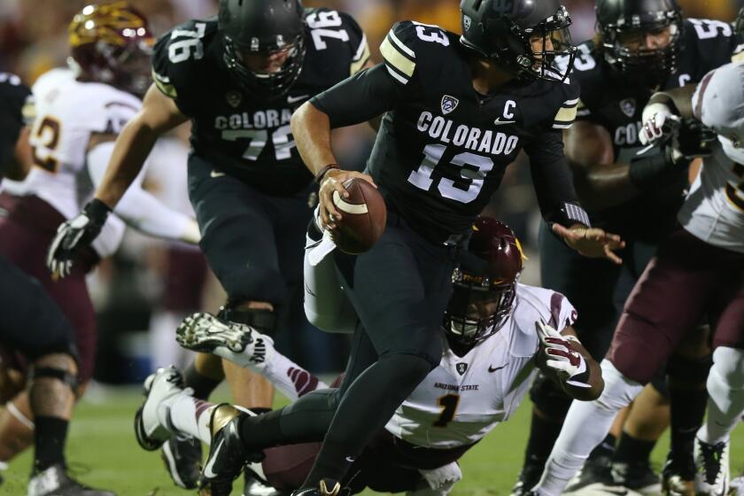 Colorado quarterback Sefo Liufau is sacked for a loss by Arizona State during a game on Sept. 13.