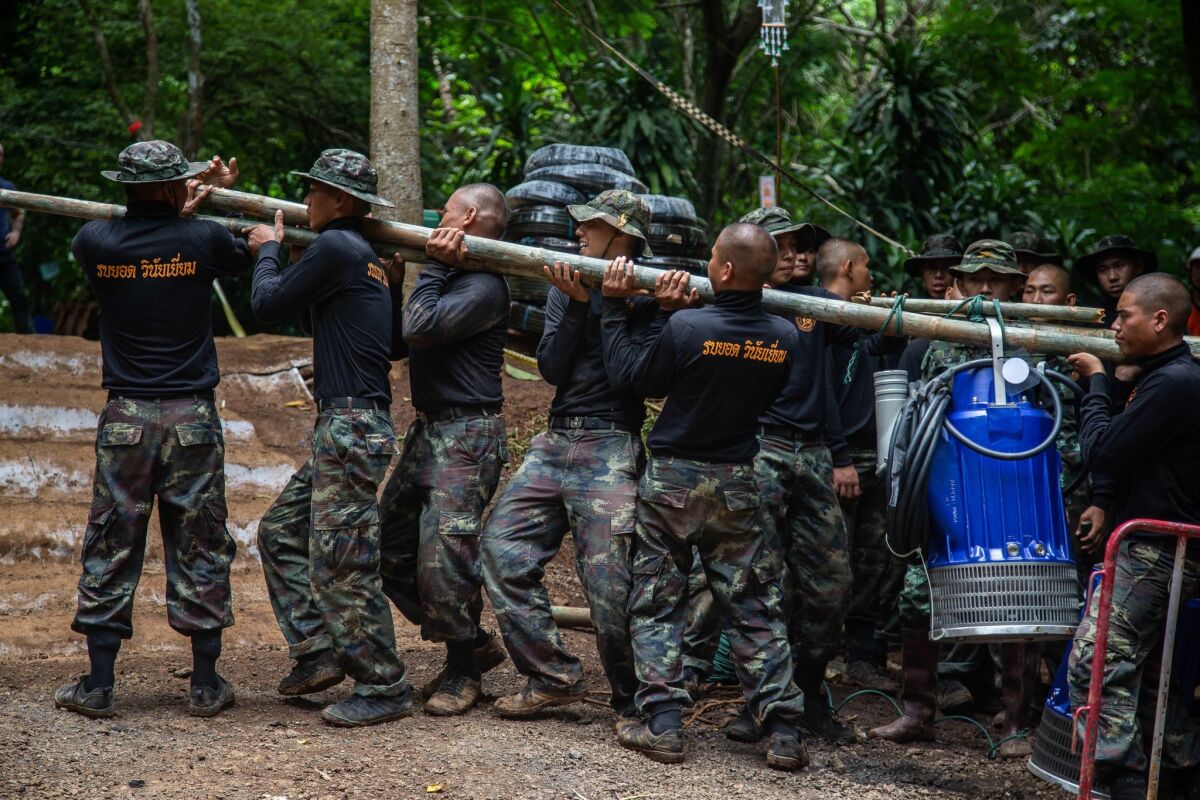Thai military bring water pumps to the cave in Chiang Rai, Thailand.