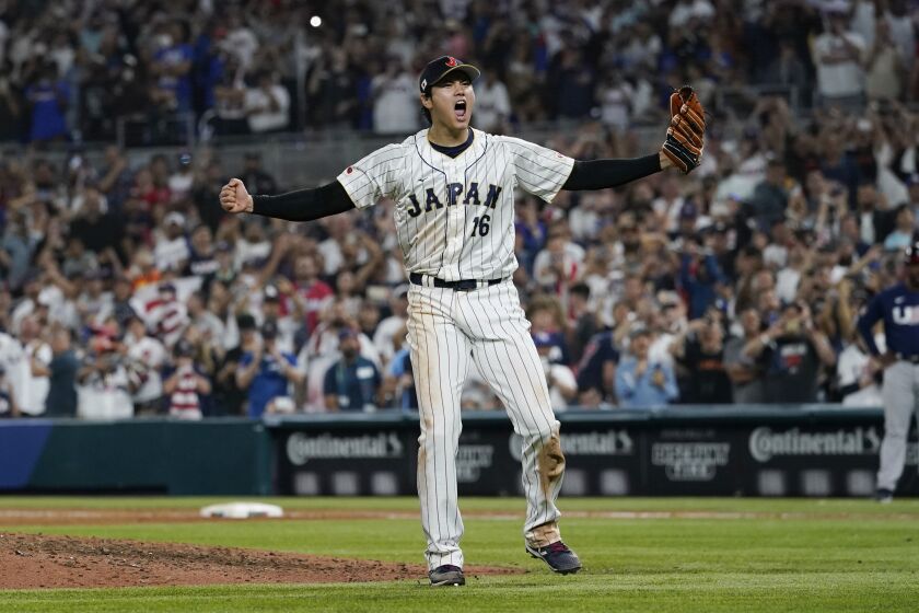 Japan pitcher Shohei Ohtani (16) celebrates after defeating the U.S.o at the World Baseball Classic final game, Tuesday, March 21, 2023, in Miami. (AP Photo/Marta Lavandier)