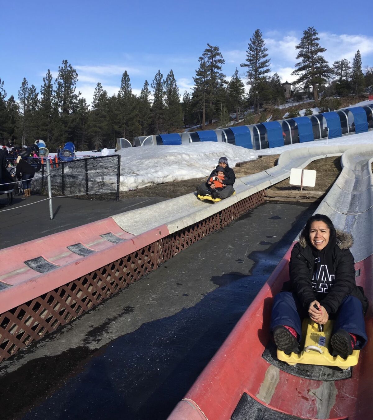 A woman on a sled in a track