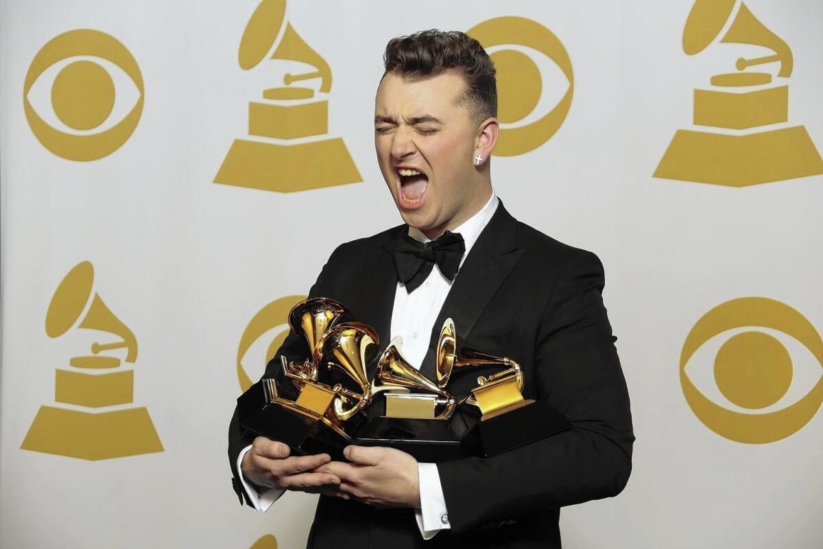 Sam Smith shows off the awards he won for song and record of the year, new artist and pop vocal album. He said his career took off when he started being himself.