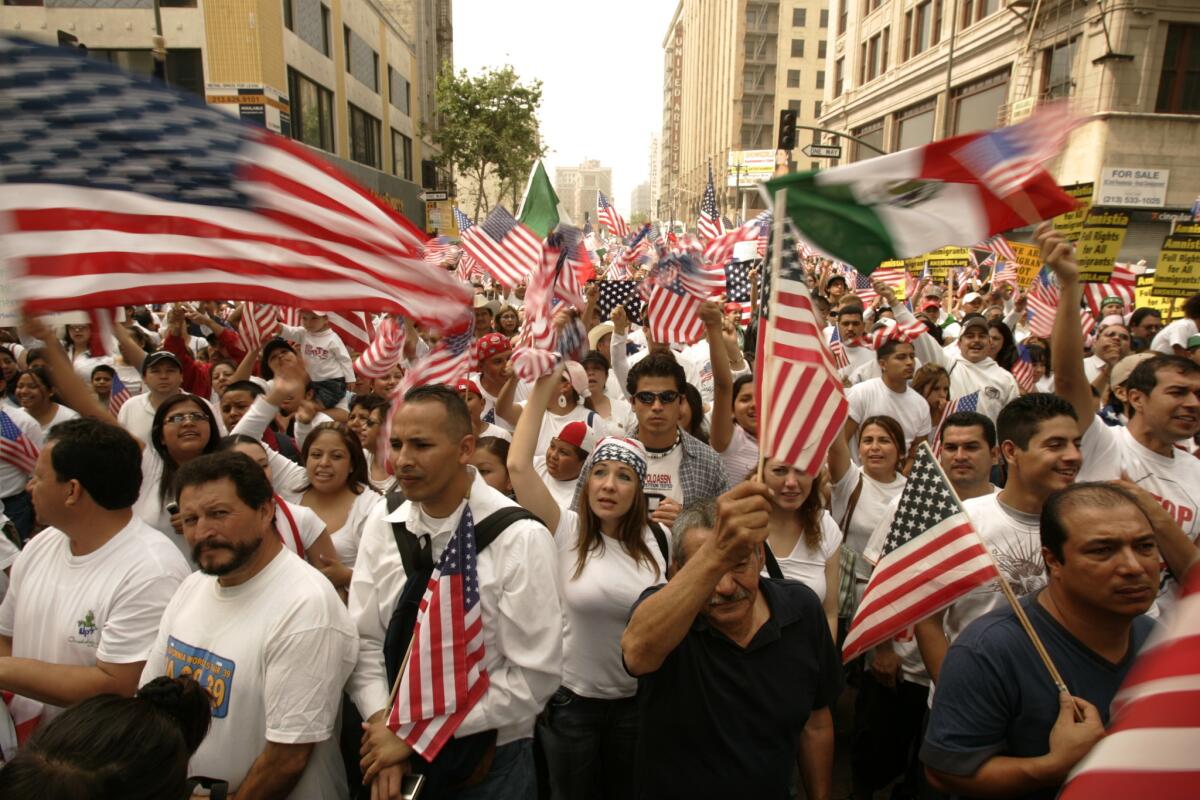 Immigrants and their supporters gather at Olympic Boulevard and Broadway in downtown Los Angeles on May 1, 2006, during a massive protest of U.S. immigration policies.