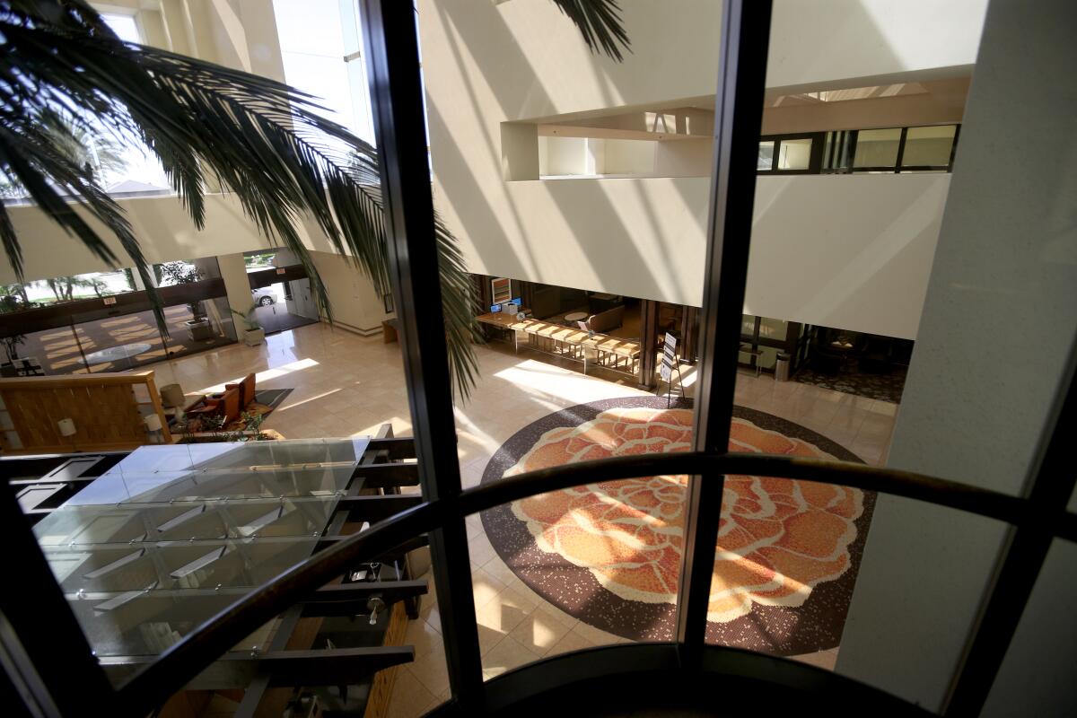 The lobby of the Hilton Orange County/Costa Mesa, seen in May 2020, sits empty during the coronavirus pandemic.