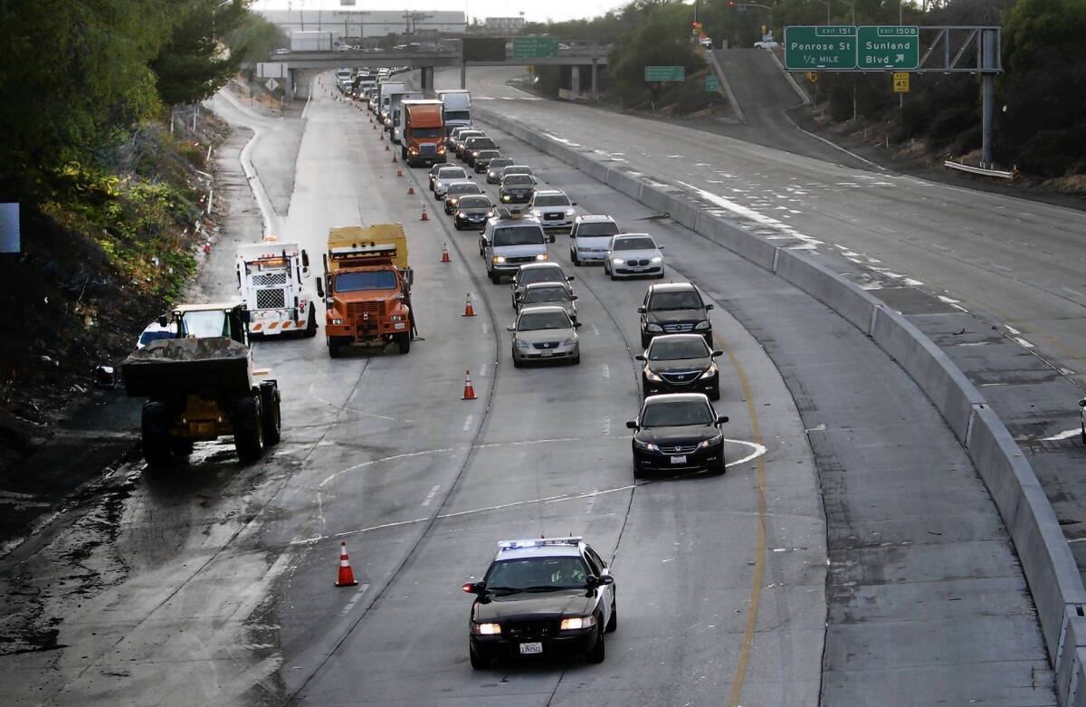 California motorists spend more than $600 a year fixing flat tires, aligning wheels and repairing other damage caused by potholes and bad pavement, according to Will Kempton, who ran the state Department of Transportation from 2004 to 2009. Above, the 5 Freeway in Sun Valley.
