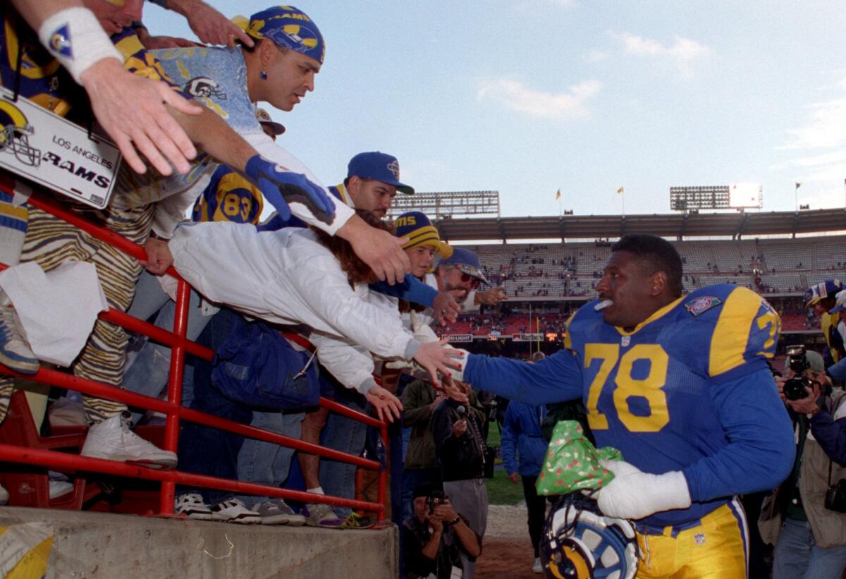 Jackie Slater shakes hands with Rams fans in 1994.