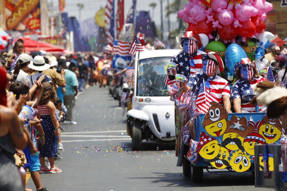 Workers from Dandy Souvenirs blow bubbles while taking part in the Hometown Heroes Parade on the final day of the San Diego County Fair on July 4, 2017. (Photo by K.C. Alfred/The San Diego Union-Tribune)