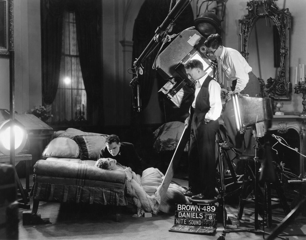 Greta Garbo, Gavin Gordon, director Clarence Brown and cinematographer William Daniels on the set of the 1930 movie "Romance."