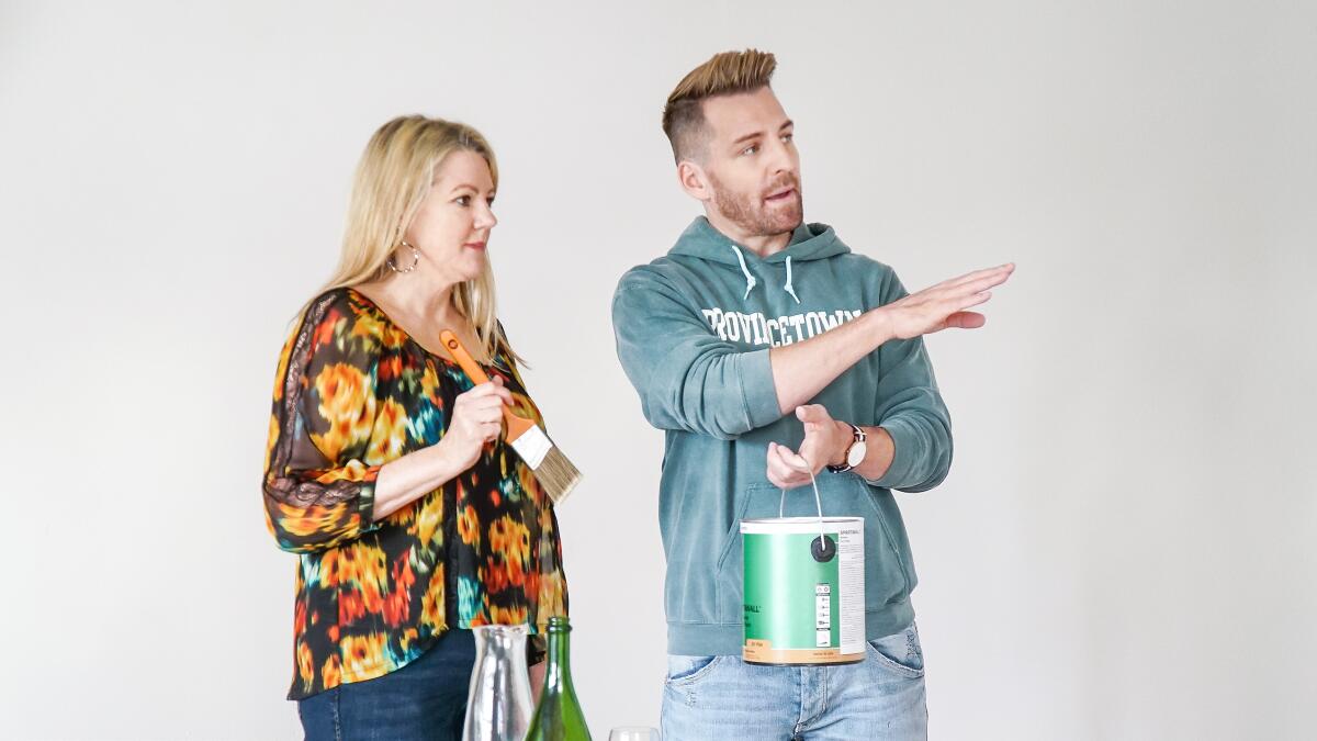 HGTV's "Build Me Up" host Orlando Soria enlists the help of homeowner Eileen for a paint project in her master bedroom.
