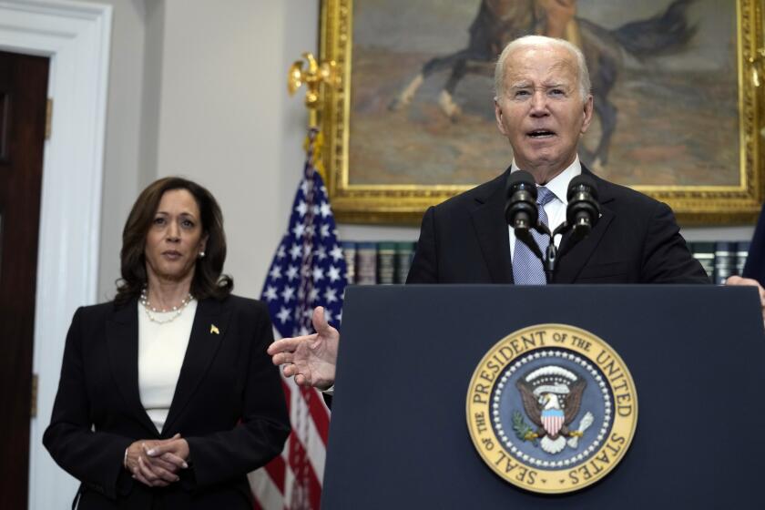 President Joe Biden speaks from the Roosevelt Room of the White House in Washington, Sunday, July 14, 2024, about the apparent assassination attempt of former President Donald Trump at a campaign rally in Pennsylvania, as Vice President Kamala Harris listens. (AP Photo/Susan Walsh)