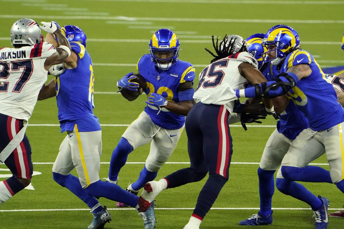 Rams running back Cam Akers eyes a small hole in the New England Patriots defense.