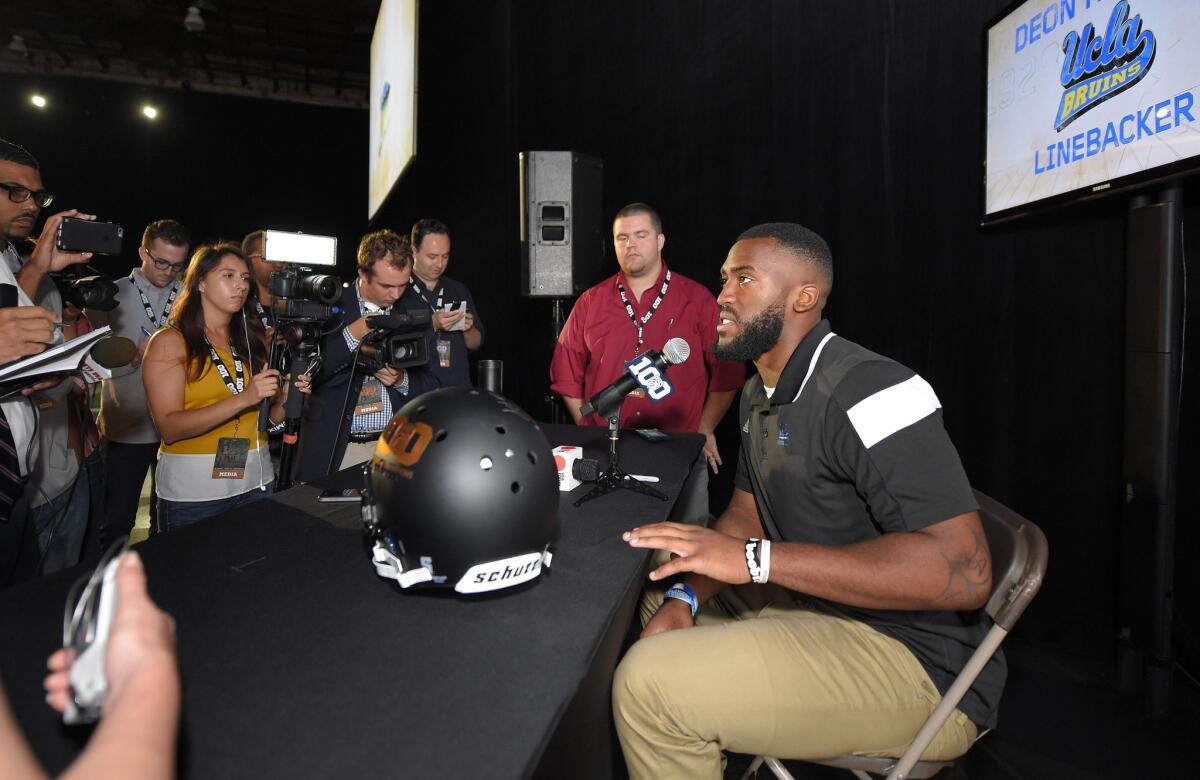 UCLA linebacker Deon Hollins speaks to reporters Thursday as part of Pac-12 football media days in Burbank.