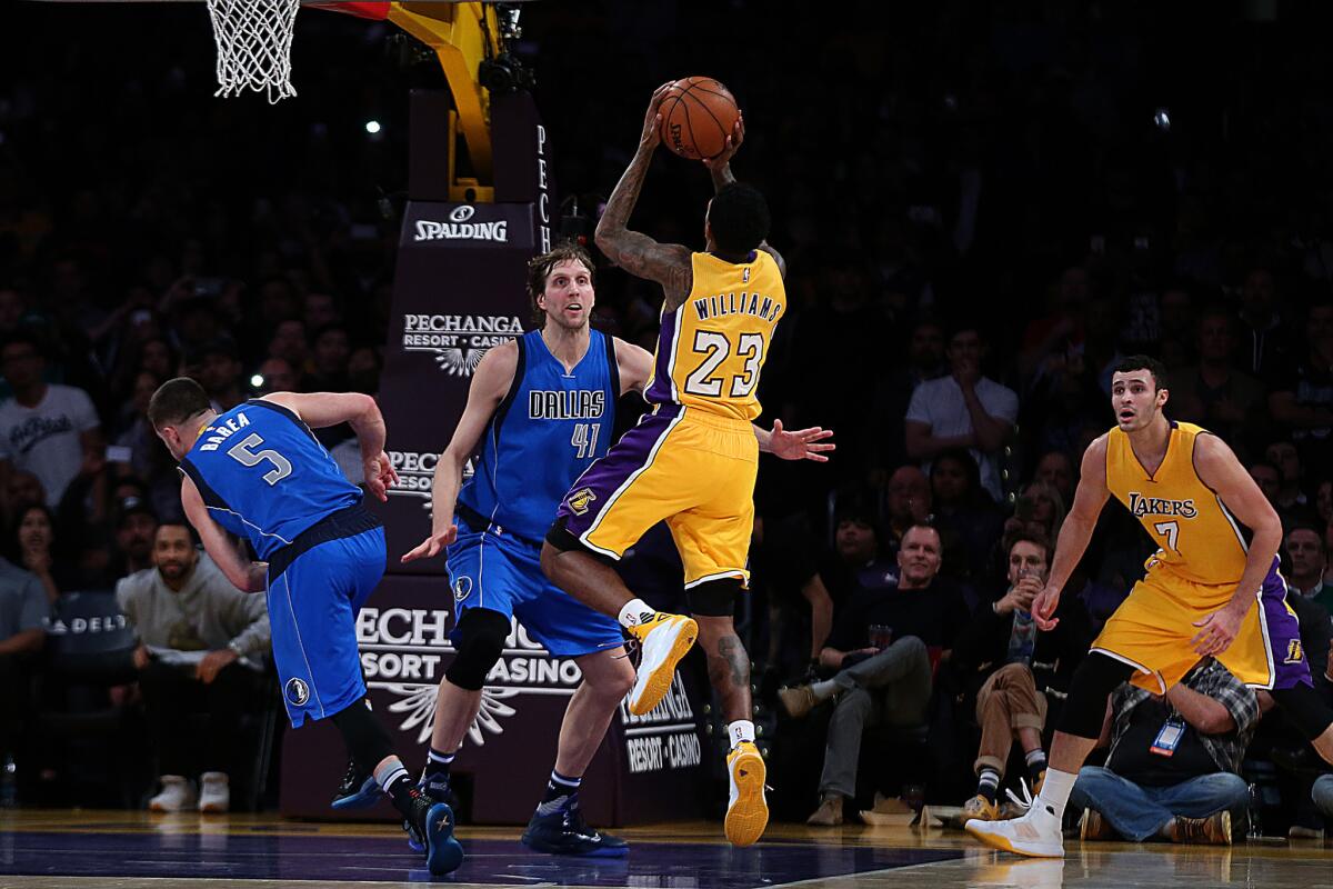 Lakers guard Lou Williams was called for pushing off Mavericks guard J.J. Barea while shooting what might have been a game-winning shot on Jan. 26.