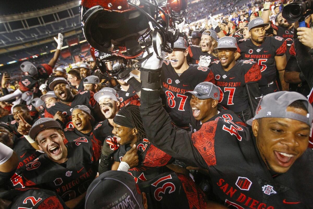 The Aztecs celebrate their 27-24 win over Air Force to win the Mountain West conference championship at Qualcomm Stadium.