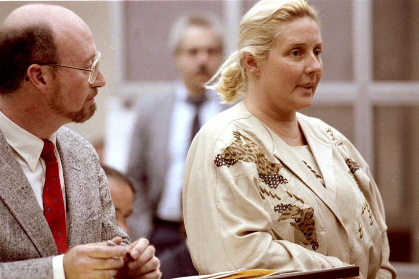 JM_Broderick_120501_11/15/1989_San Diego, CA._ELISABETH BRODERICK (right) pleads not guilty to murder charges. With her is attorney MARK WOLF (left)._San Diego Union-Tribune photograph by JERRY McCLARD
